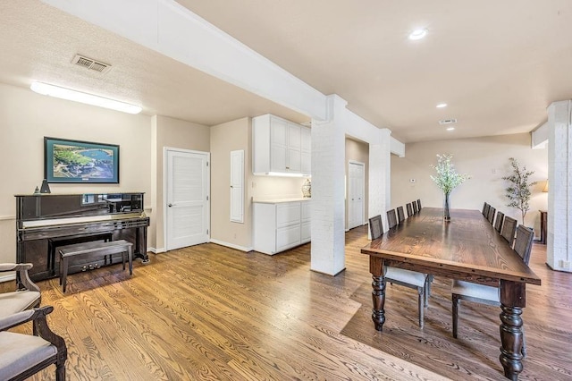 dining room with light hardwood / wood-style flooring