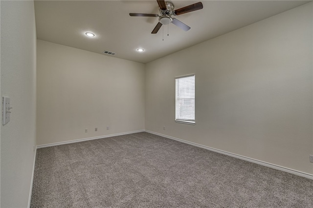 empty room with carpet flooring and ceiling fan