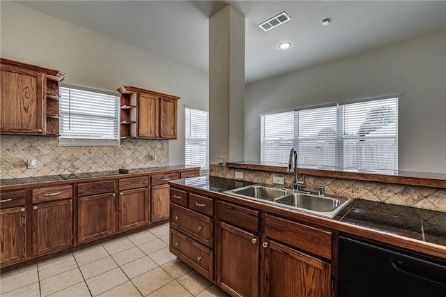 kitchen featuring backsplash, black dishwasher, light tile patterned flooring, and sink