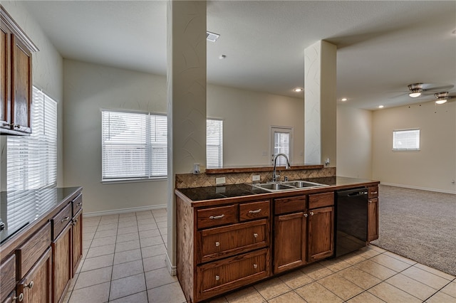 kitchen with kitchen peninsula, ceiling fan, sink, light tile patterned floors, and dishwasher