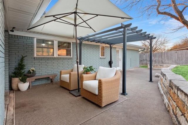 view of patio / terrace featuring fence and a pergola