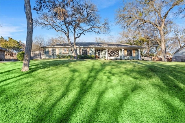 rear view of house with a yard