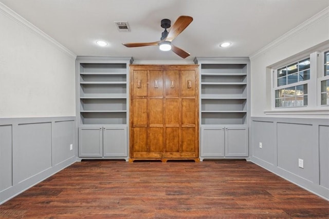 unfurnished bedroom featuring visible vents, crown molding, and wood finished floors