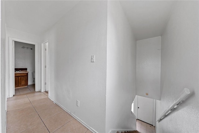 hallway featuring light tile patterned flooring