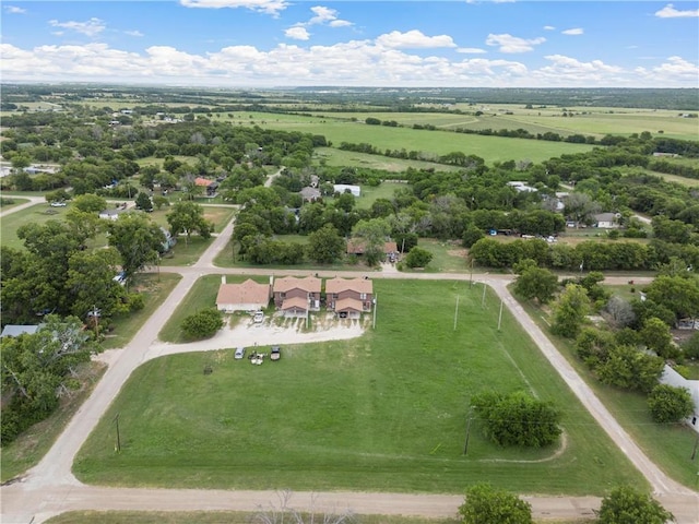 birds eye view of property with a rural view