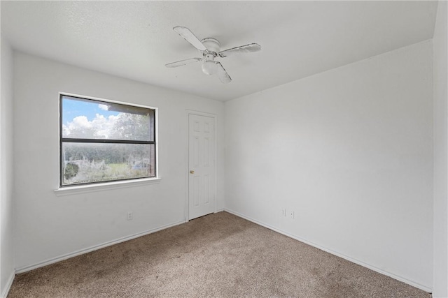 unfurnished room featuring carpet flooring and ceiling fan