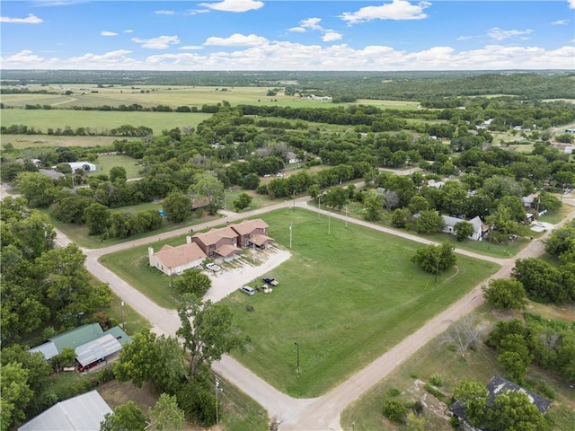 birds eye view of property with a rural view