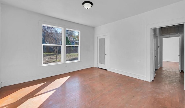 spare room featuring dark hardwood / wood-style flooring