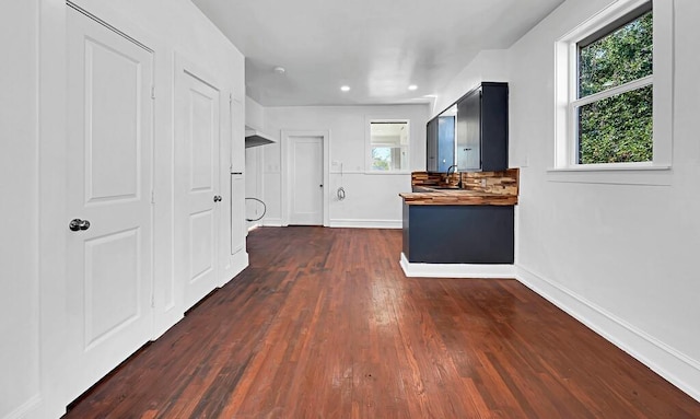 hallway featuring dark hardwood / wood-style flooring and sink