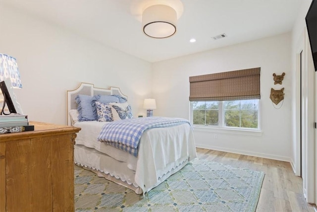 bedroom with light hardwood / wood-style flooring