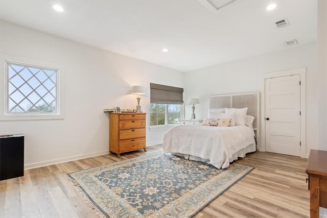 bedroom with light hardwood / wood-style flooring