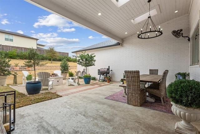 view of patio with a grill and an outdoor fire pit