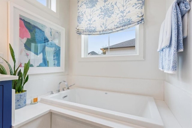 bathroom featuring vanity and a bathing tub