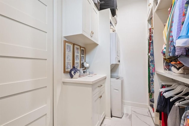 washroom featuring cabinets and washer / clothes dryer