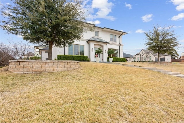 view of front of property with a front lawn