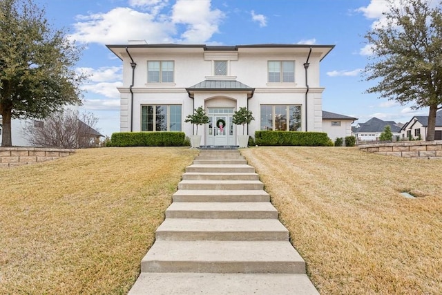 view of front of home with a front yard