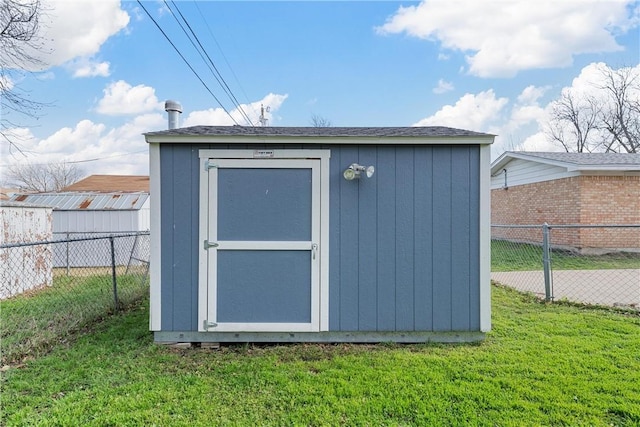 view of outdoor structure featuring a lawn