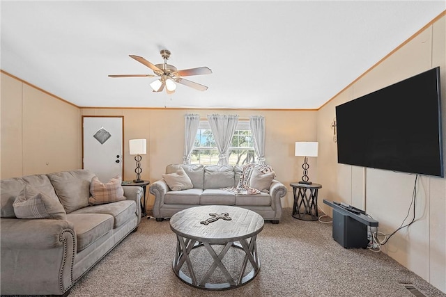 carpeted living room featuring ornamental molding, ceiling fan, and lofted ceiling