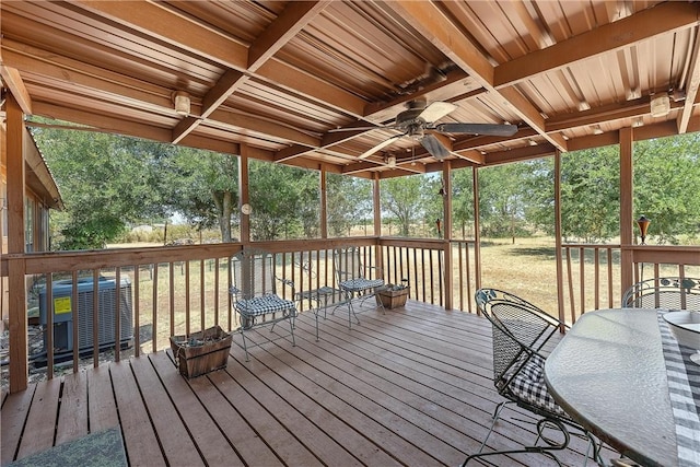 wooden deck featuring ceiling fan