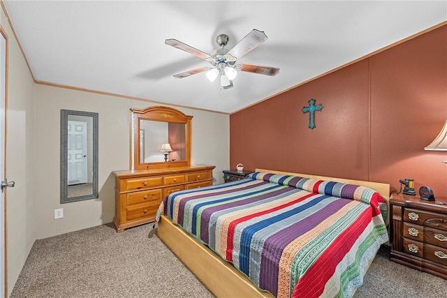 carpeted bedroom featuring ceiling fan and crown molding