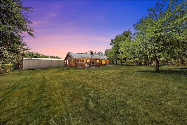 view of yard at dusk