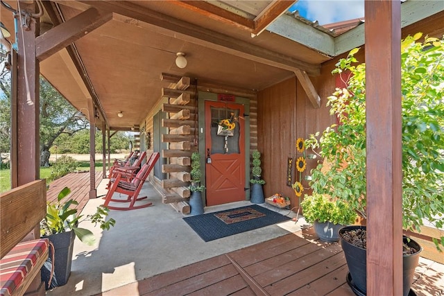 view of exterior entry with a porch