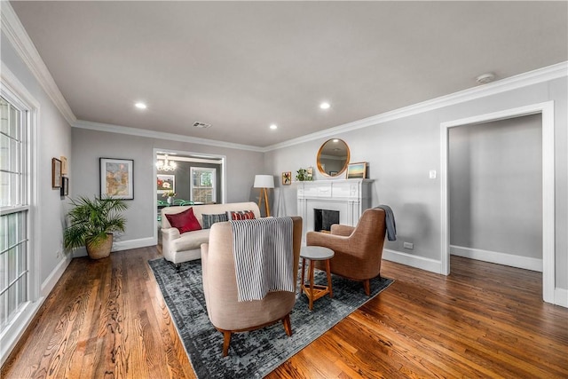 living room with crown molding and dark wood-type flooring