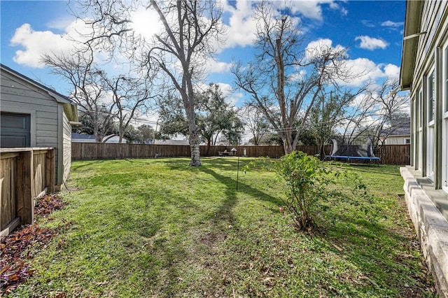 view of yard with a trampoline