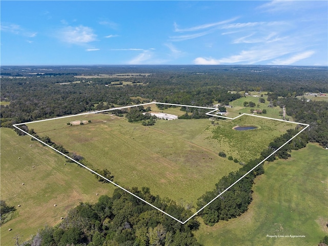 birds eye view of property with a rural view