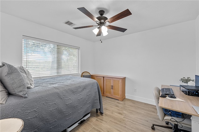 bedroom featuring ceiling fan and light hardwood / wood-style flooring