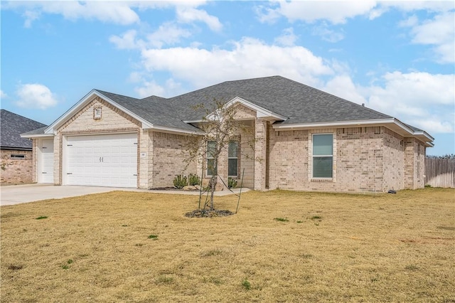 single story home with a garage and a front lawn