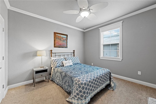 bedroom featuring ceiling fan, carpet floors, and ornamental molding