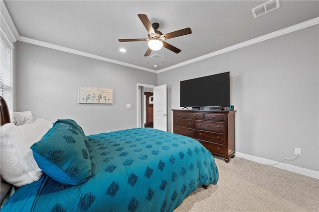 carpeted bedroom with ceiling fan and crown molding