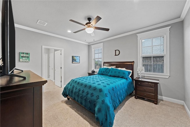 carpeted bedroom featuring multiple windows, ceiling fan, and crown molding