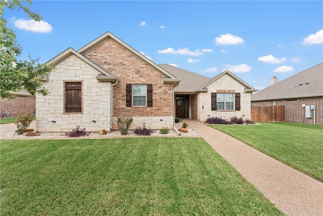 view of front of home with a front lawn