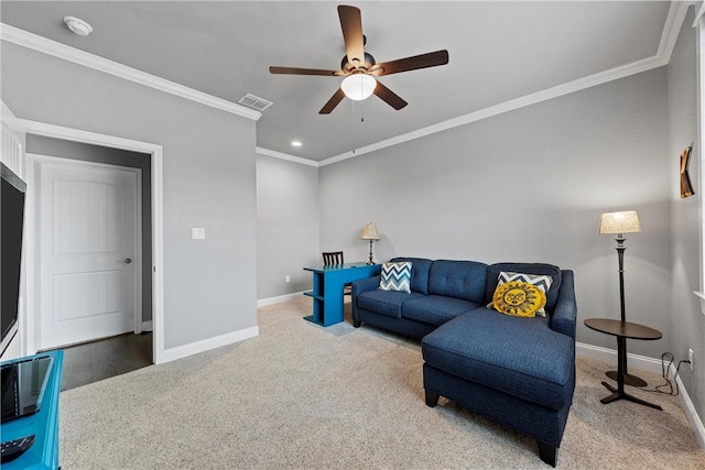 carpeted living room with ceiling fan and ornamental molding