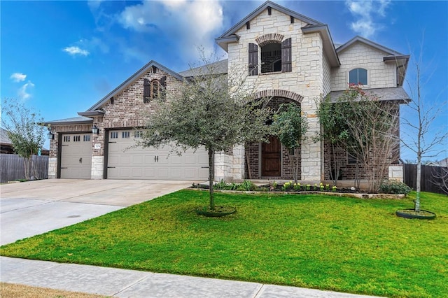 french country home featuring fence, concrete driveway, a front yard, stone siding, and an attached garage