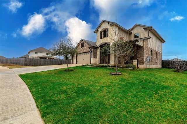 exterior space featuring brick siding, a front lawn, fence, a garage, and driveway