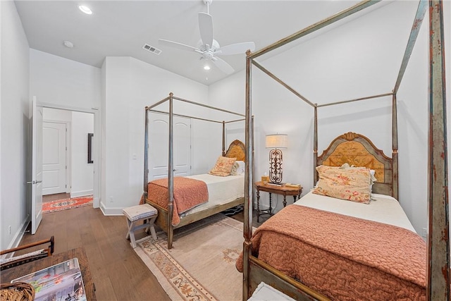 bedroom featuring ceiling fan and dark hardwood / wood-style flooring