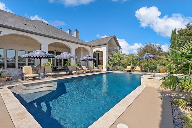 view of swimming pool featuring a patio area