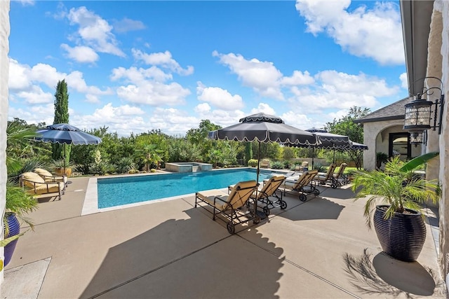 view of pool featuring an in ground hot tub and a patio area