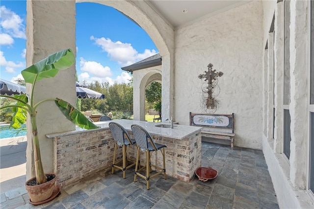 view of patio / terrace with a bar