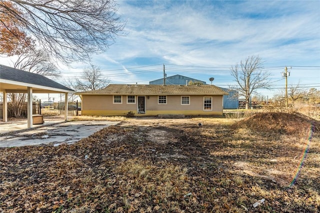 rear view of house featuring a carport