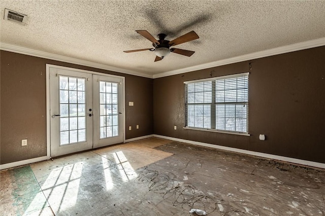 empty room with ceiling fan, french doors, crown molding, and a textured ceiling