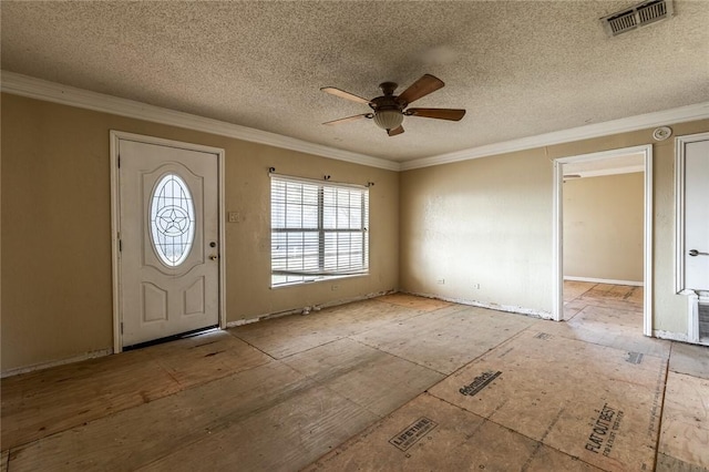 entryway with ceiling fan, ornamental molding, and a textured ceiling