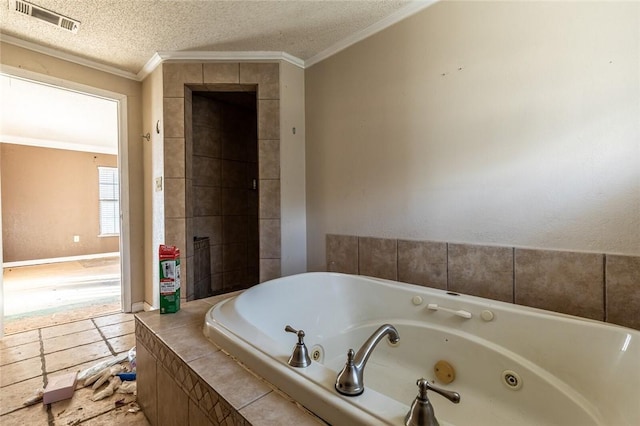 bathroom with a textured ceiling, tiled bath, and ornamental molding