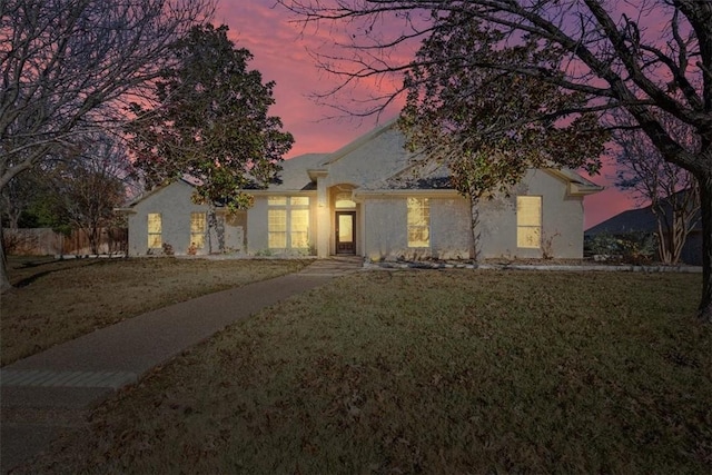 view of front of house with a yard