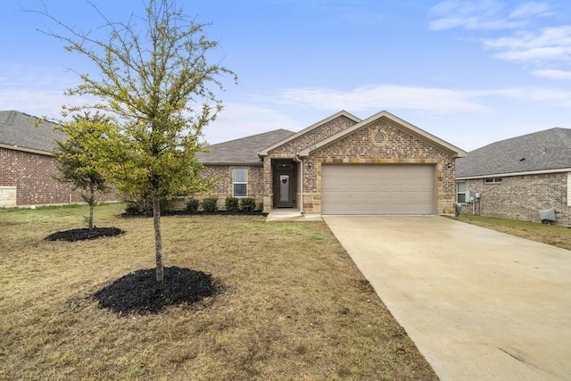 view of front of property featuring a garage and a front lawn