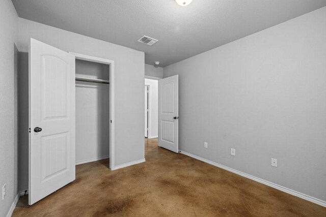 unfurnished bedroom with a closet