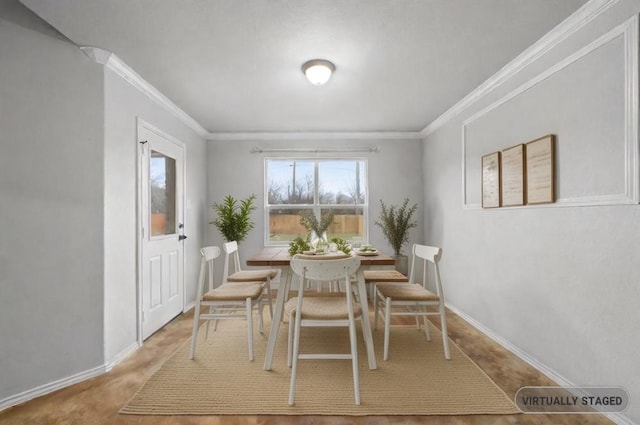 dining space featuring ornamental molding